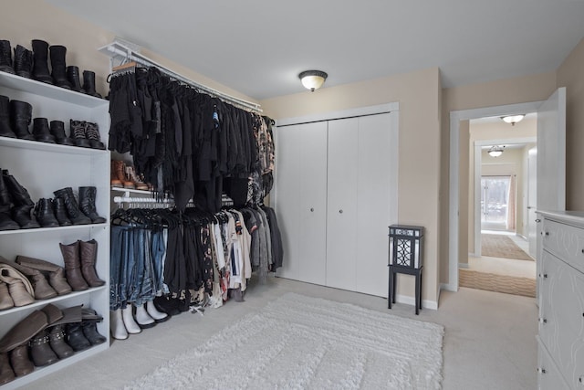 spacious closet with carpet floors