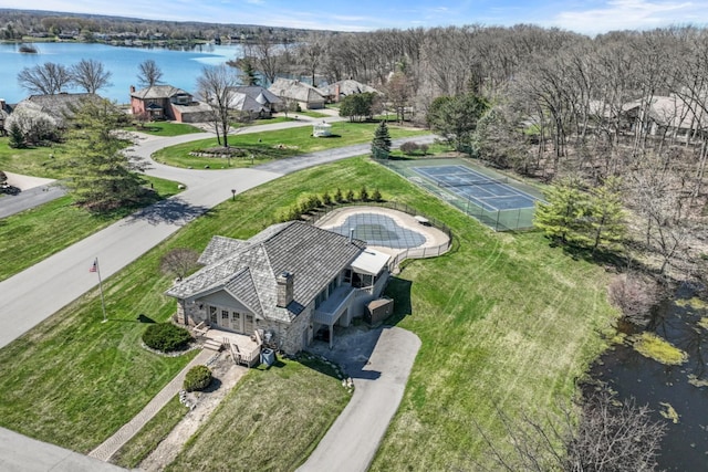 birds eye view of property featuring a water view