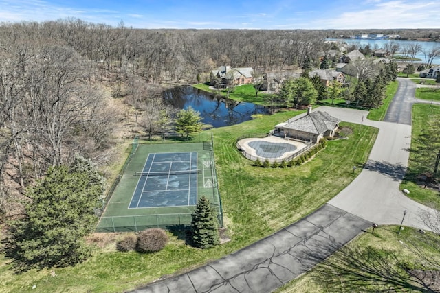 birds eye view of property with a water view