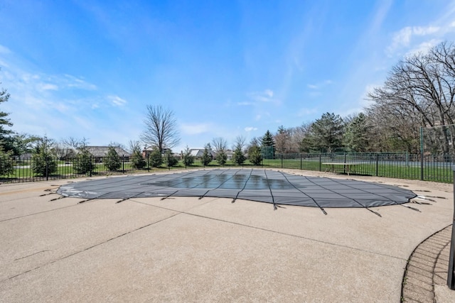 view of pool with a patio area, a fenced in pool, and fence