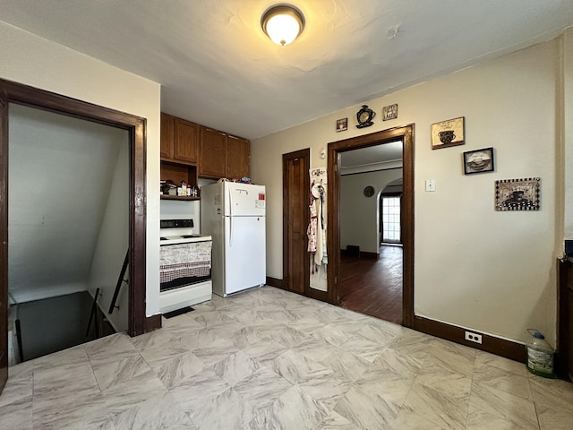 kitchen featuring arched walkways, open shelves, brown cabinetry, white appliances, and baseboards