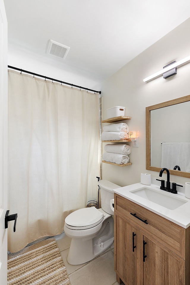 full bathroom with visible vents, a shower with shower curtain, toilet, vanity, and tile patterned flooring