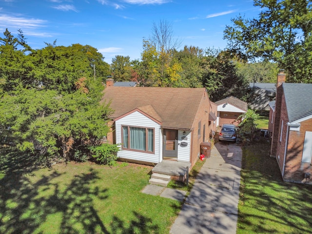 bungalow-style home with a chimney and a front lawn