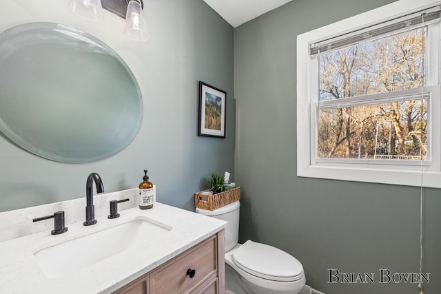 bathroom with vanity and toilet