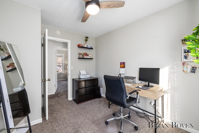 office space with ceiling fan, carpet floors, and baseboards