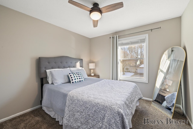 bedroom with a ceiling fan, baseboards, and carpet flooring