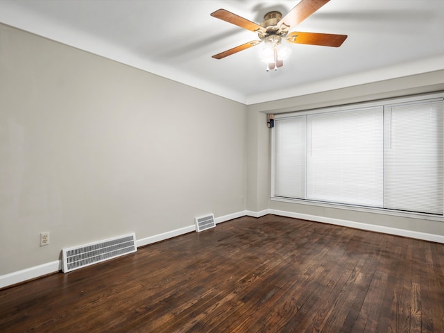 unfurnished room featuring a ceiling fan, wood-type flooring, visible vents, and baseboards