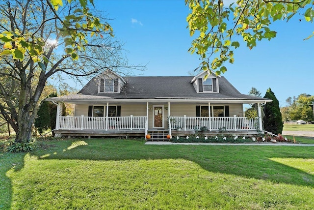 farmhouse inspired home with a porch and a front yard