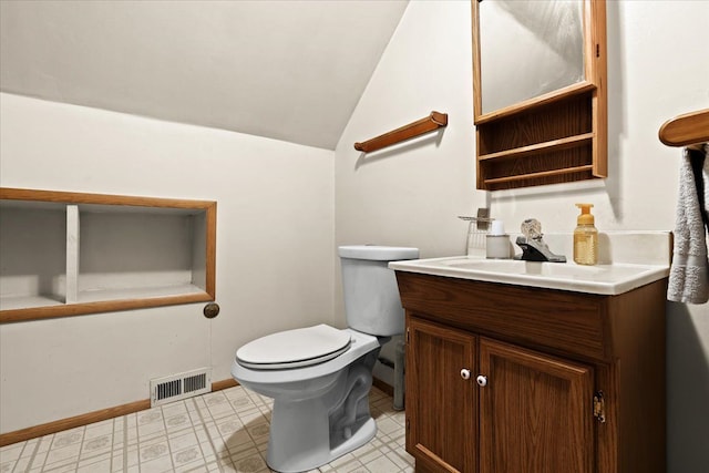 bathroom with toilet, vanity, visible vents, vaulted ceiling, and baseboards