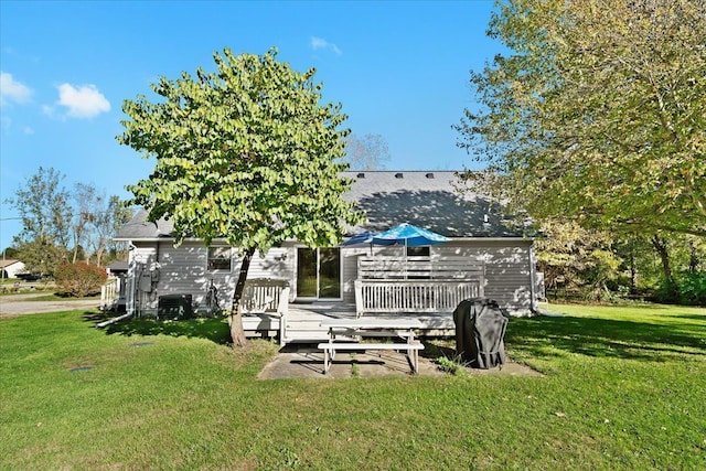 exterior space with a yard and a wooden deck