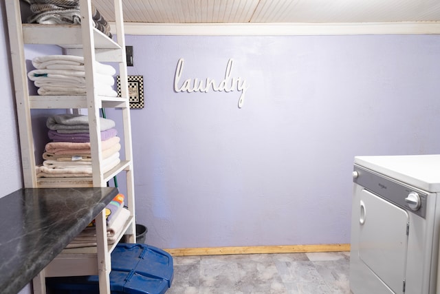 laundry area featuring washer / dryer, baseboards, and laundry area