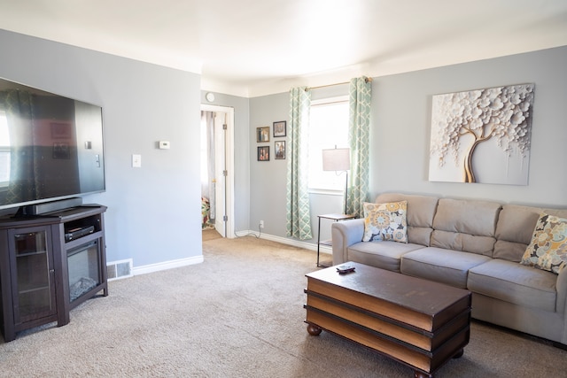 living room with carpet floors and baseboards