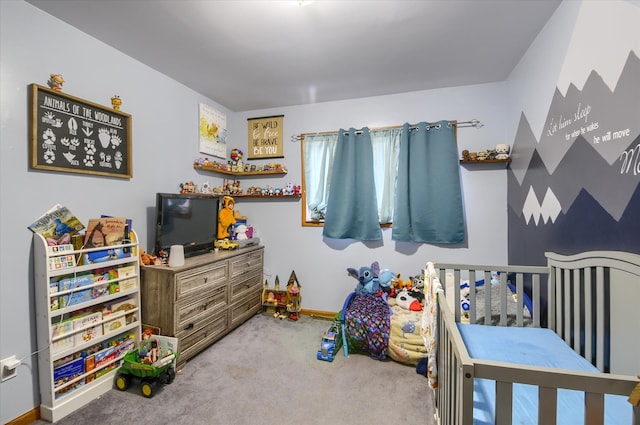 bedroom with carpet flooring and baseboards