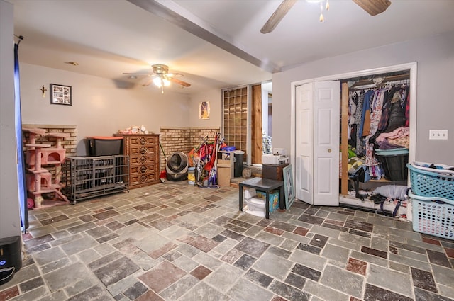 interior space with a ceiling fan