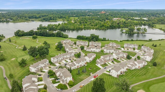 drone / aerial view with a water view and a residential view