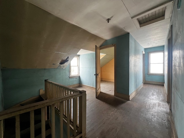 additional living space featuring vaulted ceiling