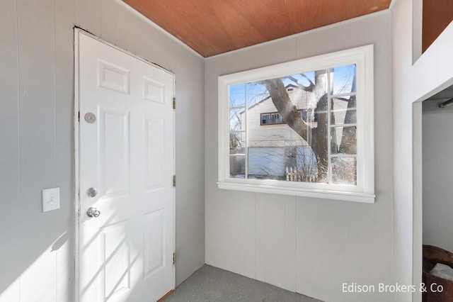 doorway to outside featuring wooden ceiling