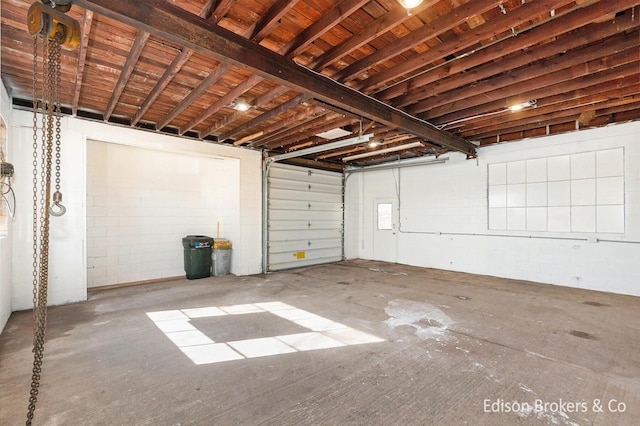 garage with concrete block wall