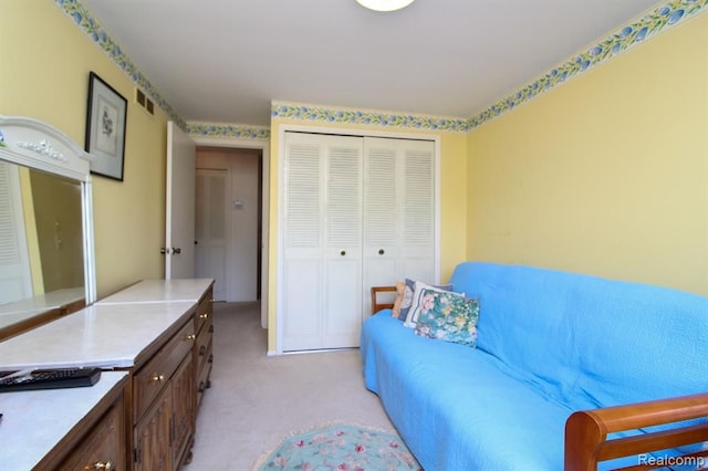 living area featuring light carpet and visible vents