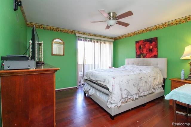 bedroom featuring dark wood-style floors, baseboards, and a ceiling fan