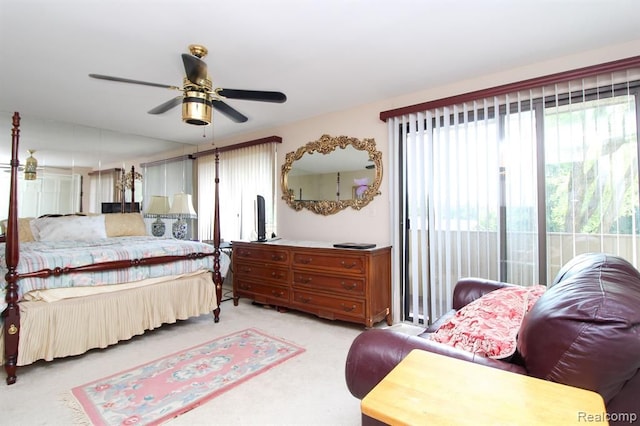 bedroom featuring access to exterior and light colored carpet