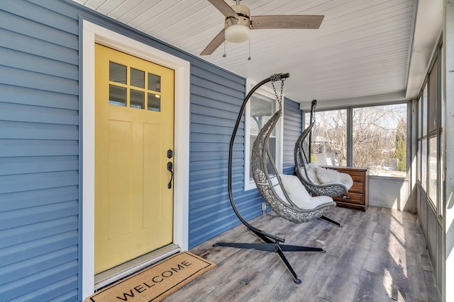 property entrance featuring ceiling fan