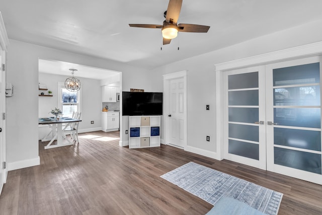 living room featuring baseboards and wood finished floors