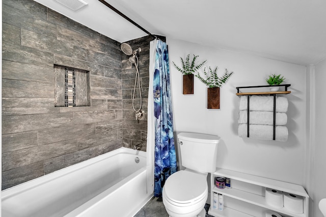 full bathroom with visible vents, shower / tub combo, and toilet