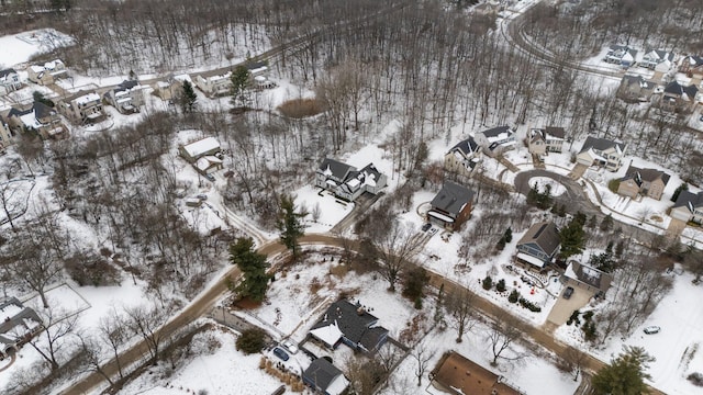 snowy aerial view featuring a residential view