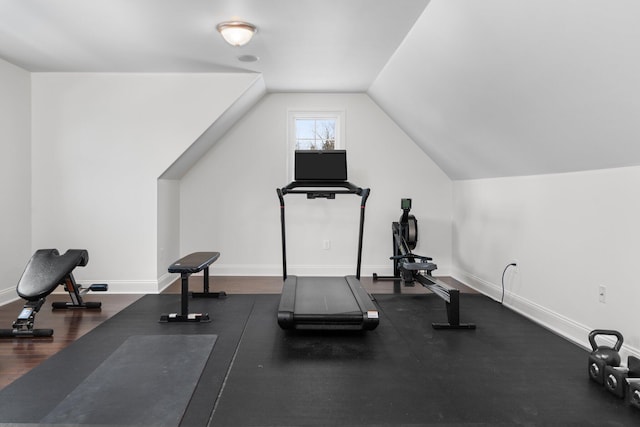 exercise area with lofted ceiling and baseboards