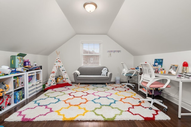 game room featuring vaulted ceiling and dark wood-type flooring