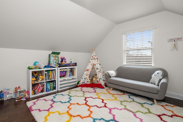 rec room with baseboards, vaulted ceiling, and dark wood-type flooring