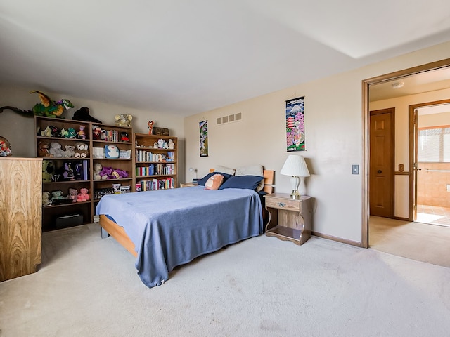 bedroom with light colored carpet, visible vents, and baseboards