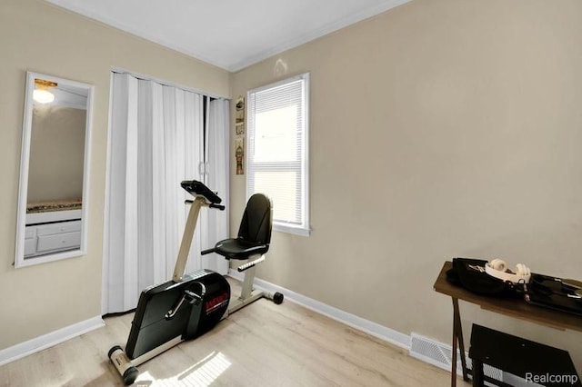 11235 Lozier Ave, Warren, MI 48089 - exercise room featuring wood finished floors, visible vents, and baseboards