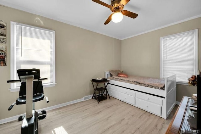 11235 Lozier Ave, Warren, MI 48089 - bedroom with light wood-type flooring, visible vents, baseboards, and ceiling fan
