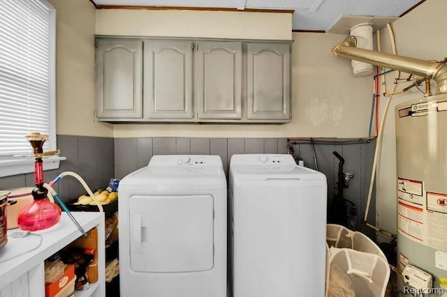 11235 Lozier Ave, Warren, MI 48089 - laundry room with wainscoting, washer and clothes dryer, gas water heater, and cabinet space