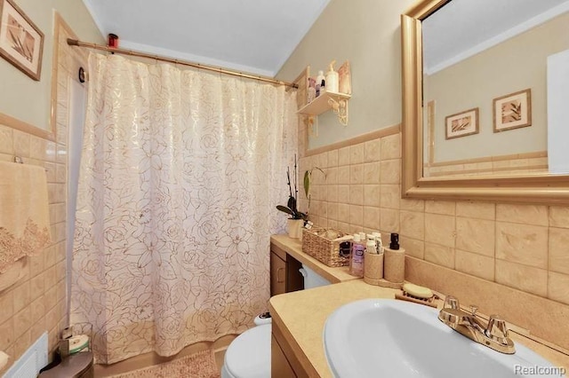 11235 Lozier Ave, Warren, MI 48089 - full bathroom featuring shower / tub combo, tile walls, toilet, and vanity