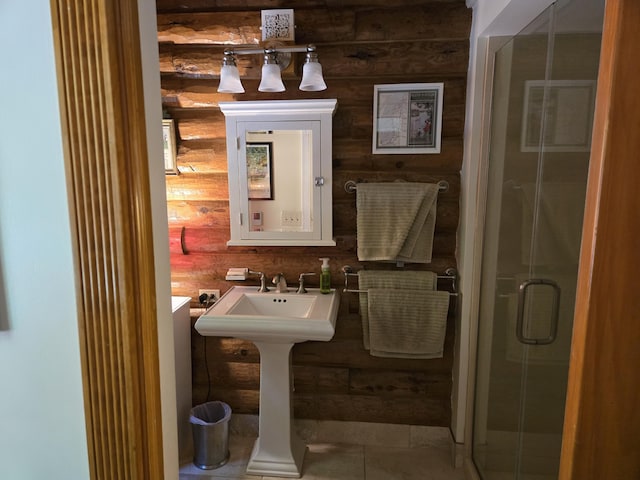 full bath with a shower stall and tile patterned floors