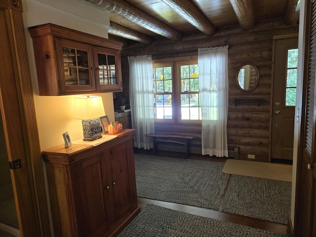 doorway with rustic walls, wood ceiling, and beamed ceiling