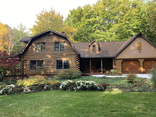 log cabin with log exterior, a front lawn, an attached garage, and a gambrel roof