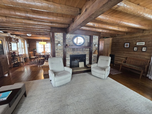 living room with log walls, a brick fireplace, wood ceiling, beamed ceiling, and hardwood / wood-style flooring