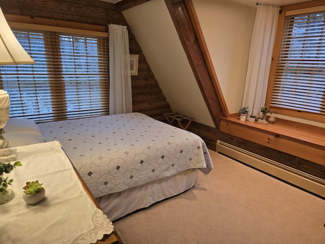 bedroom featuring a baseboard radiator, carpet, and multiple windows