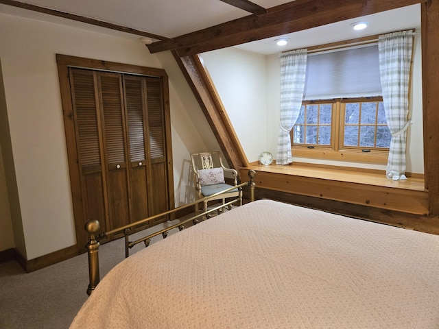 unfurnished bedroom featuring carpet, recessed lighting, a closet, beamed ceiling, and baseboards