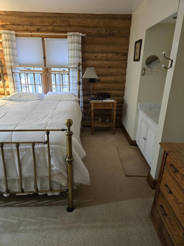 bedroom with light carpet, log walls, and baseboards