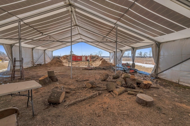 misc room with a healthy amount of sunlight and vaulted ceiling