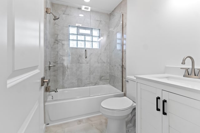 full bathroom featuring visible vents, vanity, toilet, and bath / shower combo with glass door