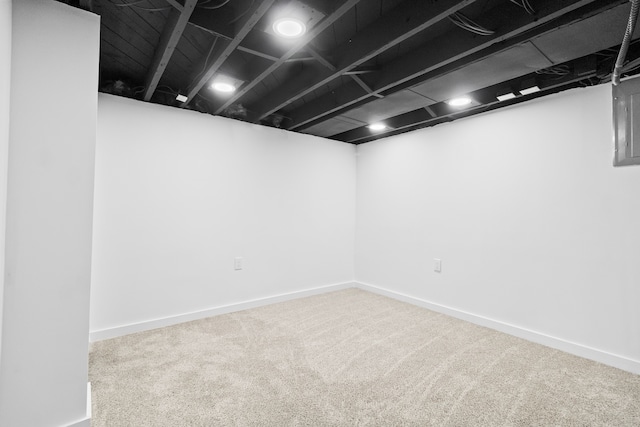 finished below grade area featuring carpet floors and baseboards