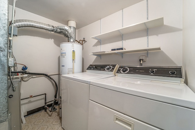 laundry area featuring water heater, laundry area, and separate washer and dryer