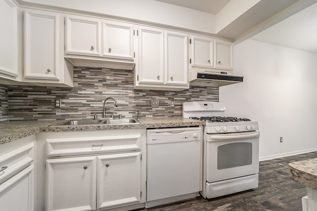 kitchen with white appliances, decorative backsplash, under cabinet range hood, white cabinetry, and a sink