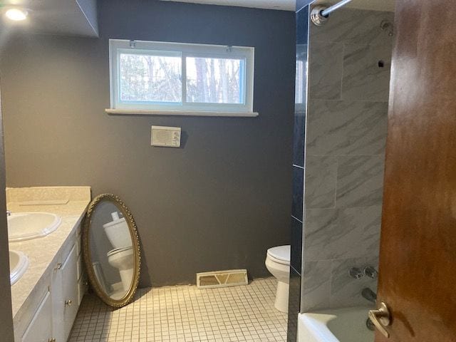 bathroom with visible vents, toilet, a sink, shower / tub combination, and tile patterned floors